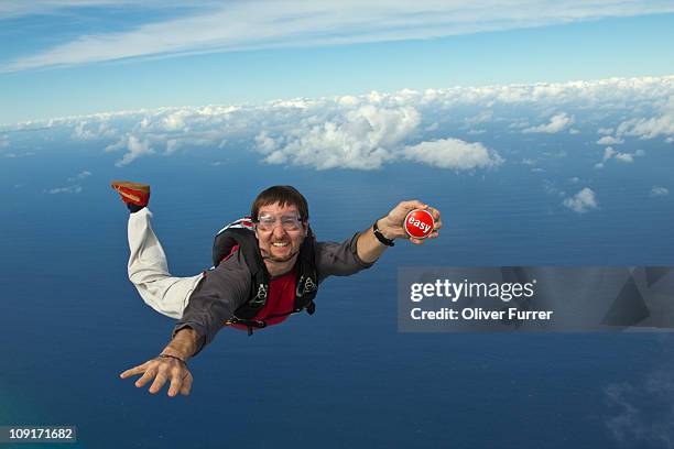 the easy button in freefall -  push it! - skydiving stock pictures, royalty-free photos & images