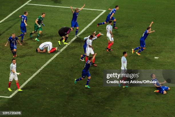 June 2016 - UEFA EURO 2016 - Round of 16 - England v Iceland - Iceland celebrate the win as England players slump to the pitch - .