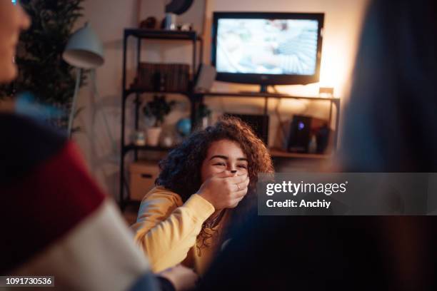 teenager-mädchen mit der hand über den mund lachen - girls sleepover stock-fotos und bilder