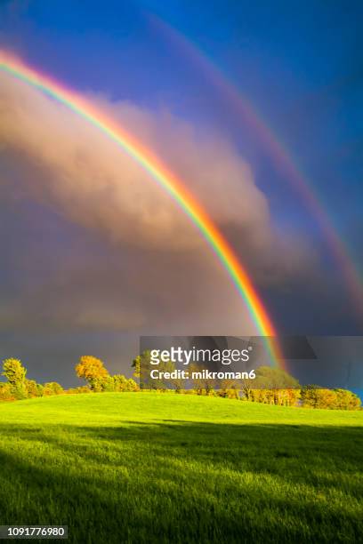 double rainbow landscape in beautiful irish landscape scenery. co tipperary ireland. - landscap with rainbow fotografías e imágenes de stock