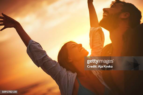 sunset dance. - romantic sunset stock pictures, royalty-free photos & images