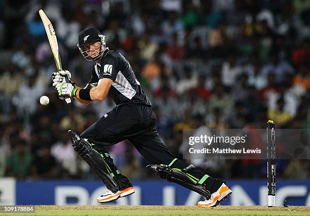 Martin Guptill of New Zealand hits the ball towards the boundary during the 2011 ICC World Cup Warm up game against India and New Zealand at the MA...