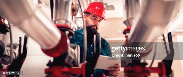 stationary engineer at work - heating engineer stock pictures, royalty-free photos & images