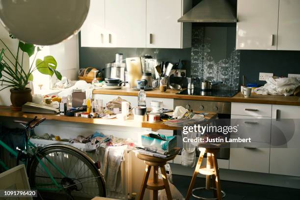 messy apartment counter tops covered in clutter - confusão imagens e fotografias de stock