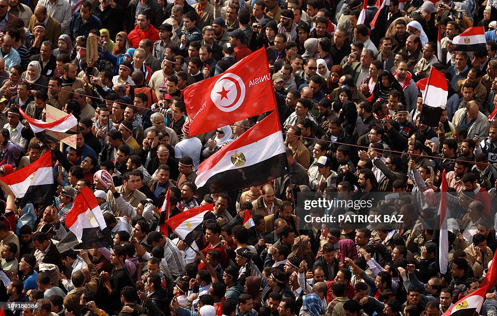 Egyptian anti-government protesters wave