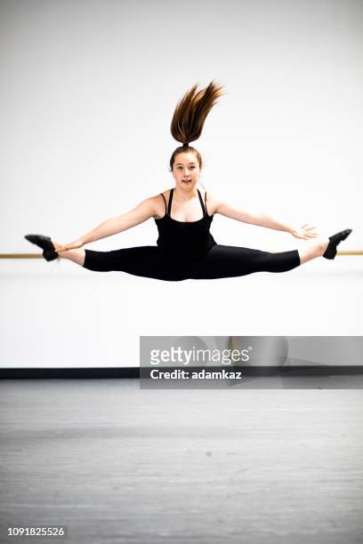 young girls practicing dance in studio - jazz dancing stock pictures, royalty-free photos & images