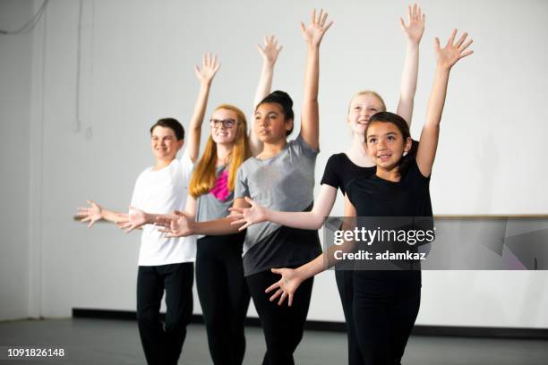 diverse young students practicing musical theatre dance in studio - musical theater stock pictures, royalty-free photos & images