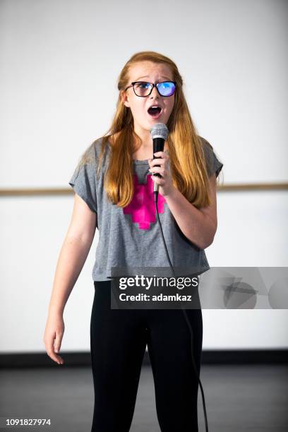 teenage girl singing at musical theatre class - audition stock pictures, royalty-free photos & images