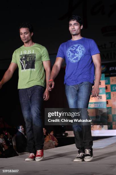 Indian models walk the runway during the launch of Pantaloons '3 Idiots' T-shirt Collection held at Phoenix Mall on December 4, 2009 in Mumbai, India.