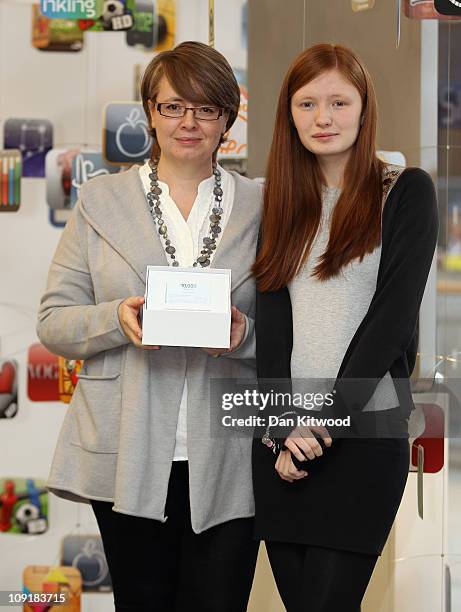 Gail Davis and Daughter Emma Davis 17, from Orpington in Kent, pose for pictures at the Apple Store in the Bluewater Shopping Centre, after winning...