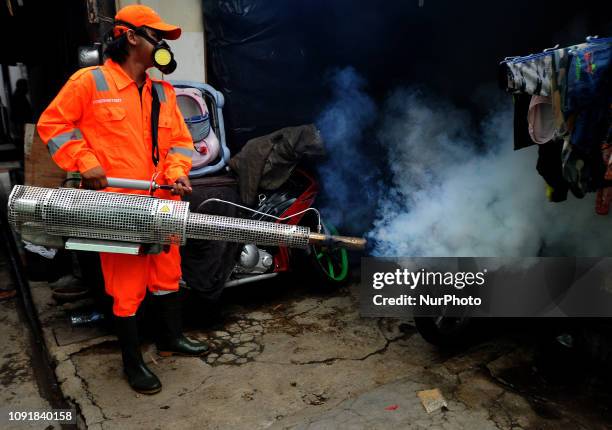 Officers carried out fumigation in the slum areas of the population and narrow alleys to prevent dengue fever diseases and viruses caused by Aedes...