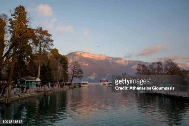 Panoramic view of Gardens of Europe and Lake Annecy on December 31, 2018 in Annecy, France. Gardens of Europe is scenic lakeside park with mountain...