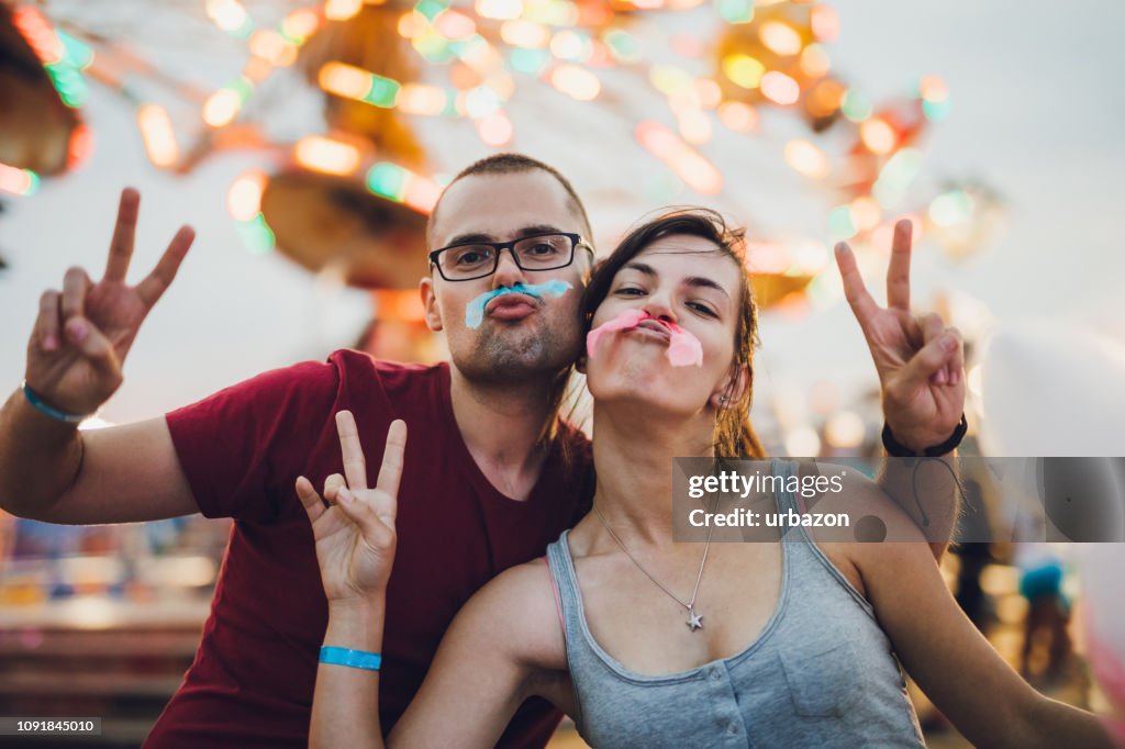 Young couple in amusement park
