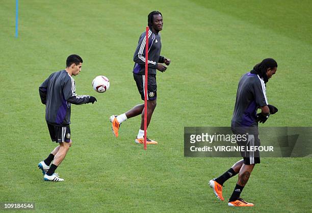 Anderlecht players Mbark Boussoufa, Romelu Lukaku and Rubenilson Dos Santos warm up during a training session of RSCA Anderlecht in Brussels on...