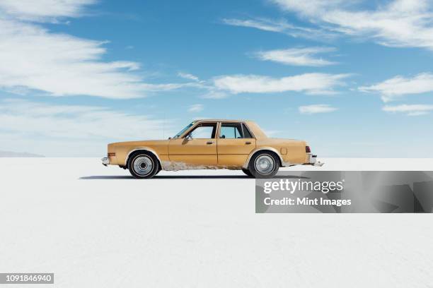old pontiac parked on salt flats - carro tipo sallon imagens e fotografias de stock