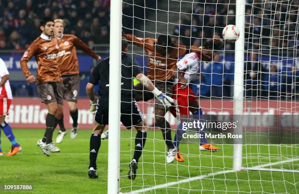 Gerald Asamoah of St.Pauli head's his team's opening goal during the Bundesliga match between Hamburger SV and FC St.Pauli at Imtech Arena on...