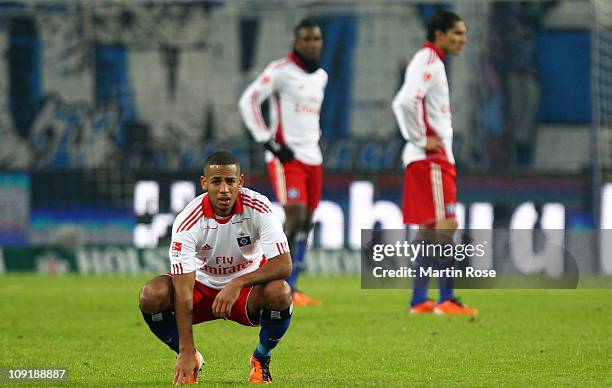 Dennis Aogo of Hamburg and his team mates look dejected after the Bundesliga match between Hamburger SV and FC St.Pauli at Imtech Arena on February...