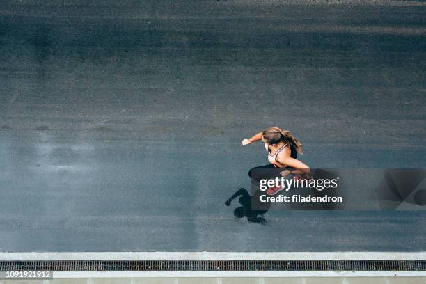 jogging on the street - street running stock pictures, royalty-free photos & images