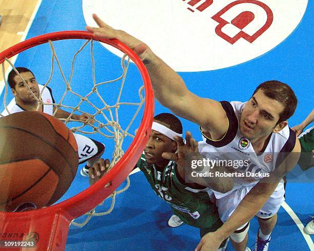 Kaya Peker, #14 of Fenerbahce Ulker Istanbul competes with Travis Watson, #35 of Zalgiris Kaunas in action during the 2010-2011 Turkish Airlines...
