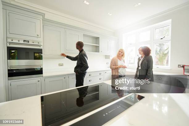 house viewing couple - quartz kitchen stock pictures, royalty-free photos & images