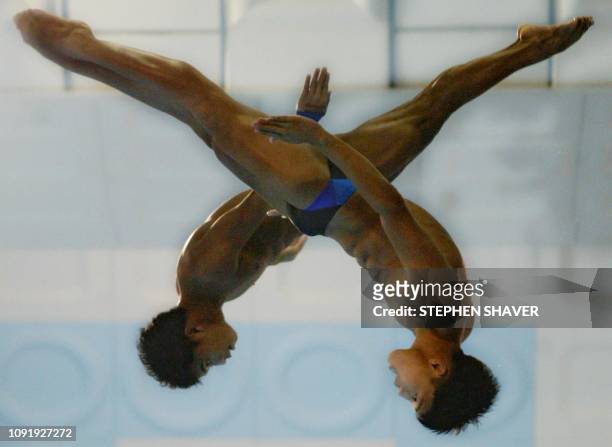 Phillippines' Ryan Rexel Fabriga and Jaime Asok perform in the men's 10m Synchronized Diving event 08 October 2002 at the 14th Asian Games in Busan....