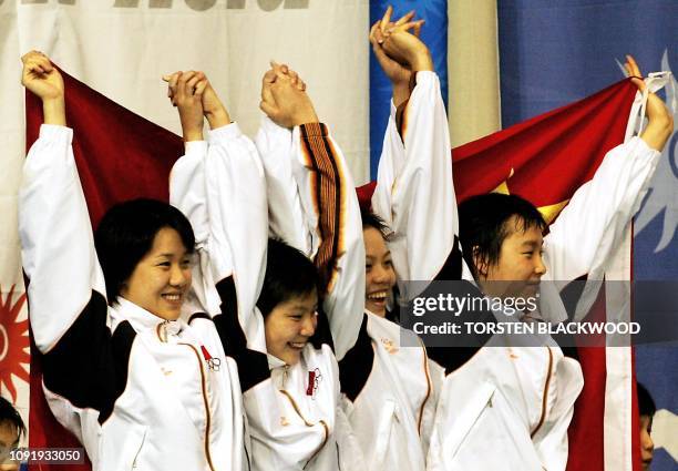 China's 4 x 200 freestyle winners from R-L Yang Yu, Xu Yanwei, Tang Jingzhi and Zhu Yingwen celebrate during the 14th Asian Games in Busan, 01...