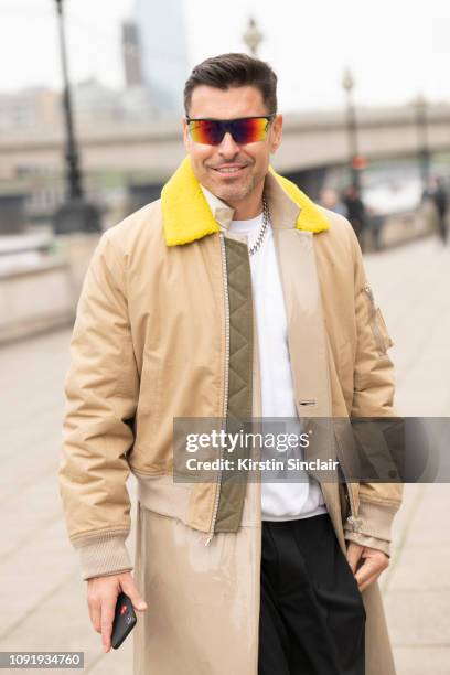 Style Director Alex Badia wears Giorgio Armani sunglasses, Helmut Lang cropped jacket during London Fashion Week Men's January 2019 on January 07,...