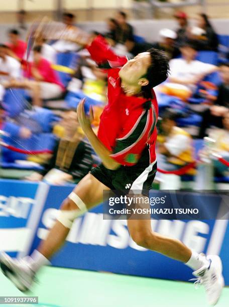 Indonesia's Taufik Hidayat fires a jumping smash against South Korea's Shon Seung-Mok during their badminton men's singles semi-final match at the...