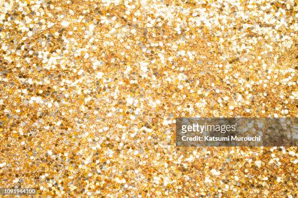 gold glitter texture background - glitter stock pictures, royalty-free photos & images