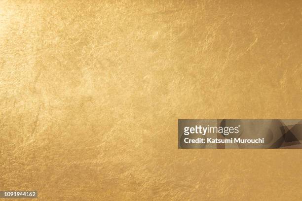 gold foil texture background - gold coloured stock pictures, royalty-free photos & images