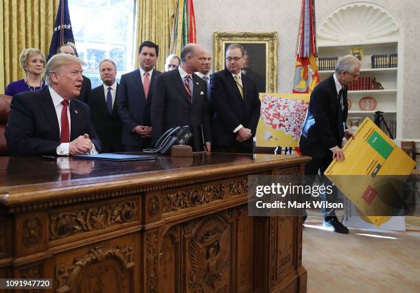 President Donald Trump speaks during a meeting with members of Congress and American manufacturers before signing an executive order to strengthen...