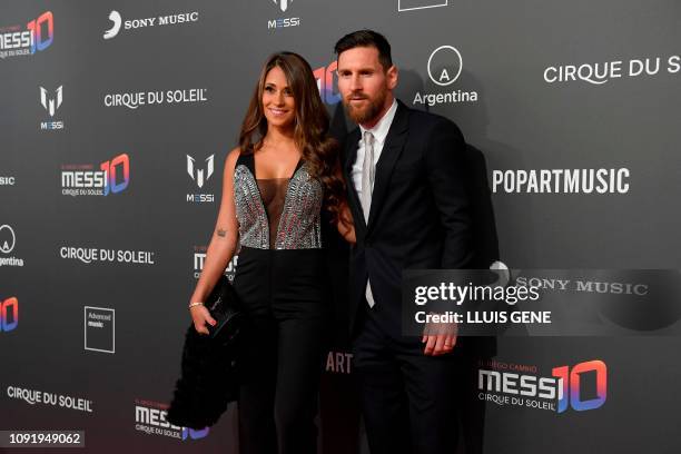 Barcelona's Argentinian forward Lionel Messi and his wife Antonella Roccuzzo pose on the red carpet during a photocall for Cirque du Soleil's latest...