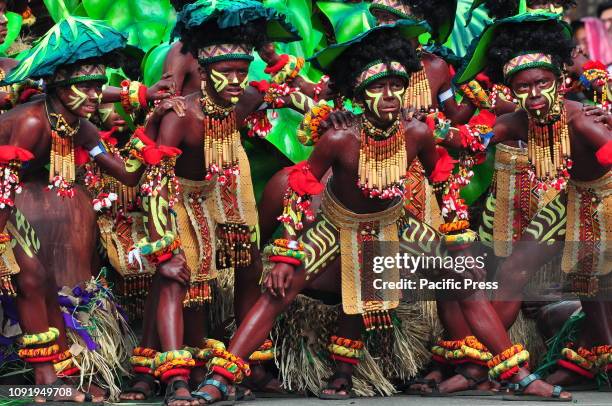 The dancers are wearing colorful costumes and headdress matching with their face and body paint according to their tribe. The Dinagyang Festival of...