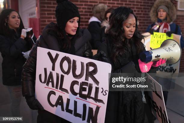 Demonstrators gather near the studio of singer R. Kelly to call for a boycott of his music after allegations of sexual abuse against young girls were...