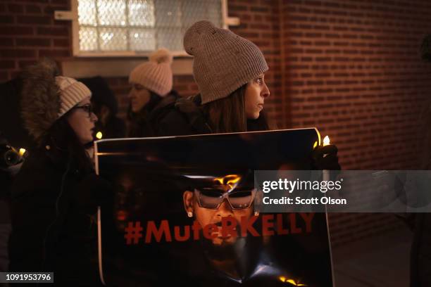 Demonstrators gather near the studio of singer R. Kelly to call for a boycott of his music after allegations of sexual abuse against young girls were...