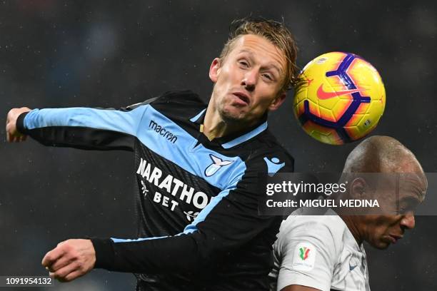 Lazio's Brazilian midfielder Lucas Leiva and Inter Milan's Portuguese midfielder Joao Mario go for a header during the Italian Tim Cup round of eight...