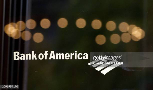 In this file photo taken on August 19, 2011 a Bank of America logo is seen on the door outside a bank branch in Washington, DC. - With two months...