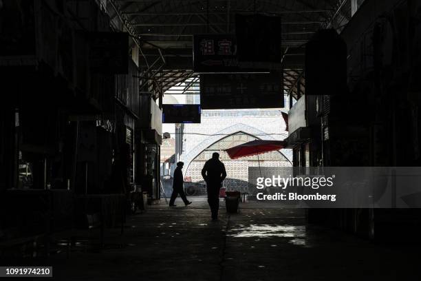 People walk through the main bazaar in Kashgar, Xinjiang autonomous region, China, on Friday, Nov. 9, 2018. Although it represents just 1.5 percent...