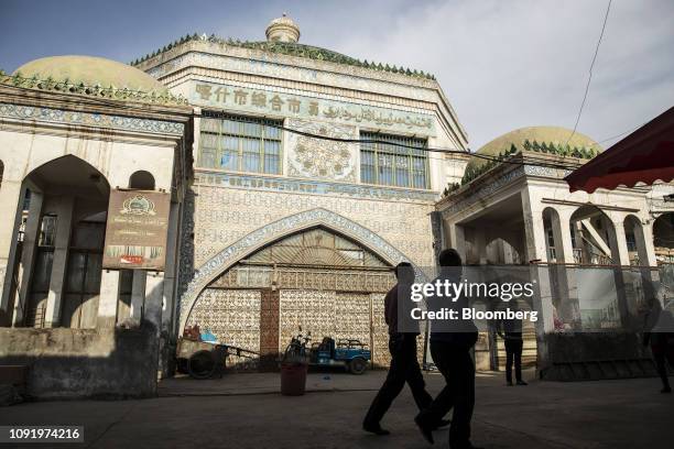 Pedestrians walk past the main bazaar in Kashgar, Xinjiang autonomous region, China, on Thursday, Nov. 8, 2018. Although it represents just 1.5...