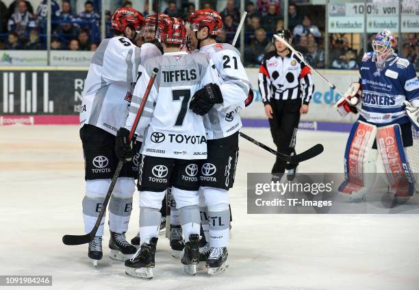 Frederik Tiffels of Koelner Haie celebrates after scoring his team's second goal with team mates during the DEL match between Iserlohn Roosters and...