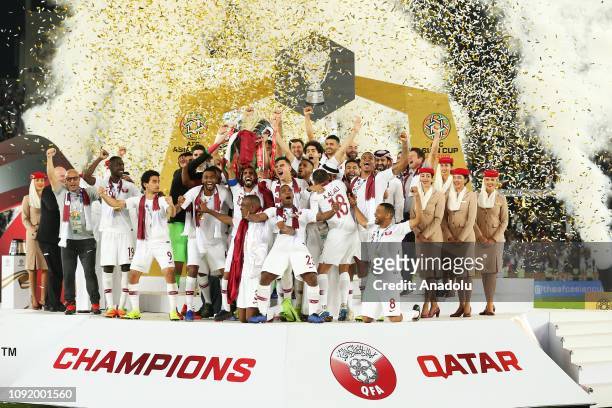 Qatar's players celebrate with the trophy after winning the 2019 AFC Asian Cup final match between Japan and Qatar in Abu Dhabi, United Arab...