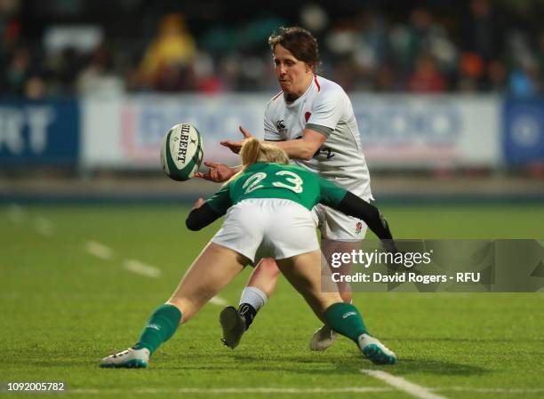 Katy Daley-Mclean of England is tackled by Alison Miller of Ireland during the Women's Six Nations match between Ireland and England at Energia Park,...