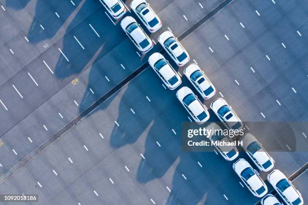 the aerial photograph of the outdoor warehouse of the new car. - car exports imagens e fotografias de stock