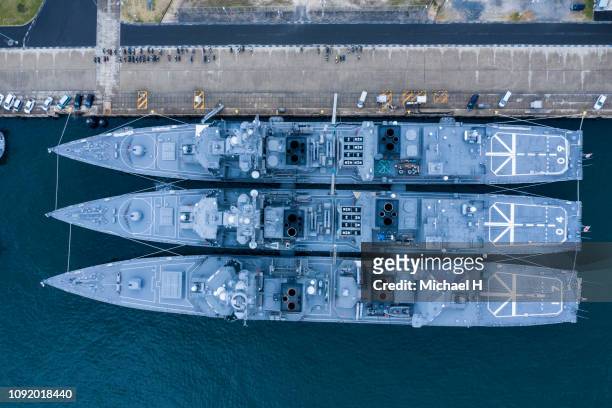 aerial shooting of battleships anchored. viewpoint from directly above. - legal defense stock pictures, royalty-free photos & images