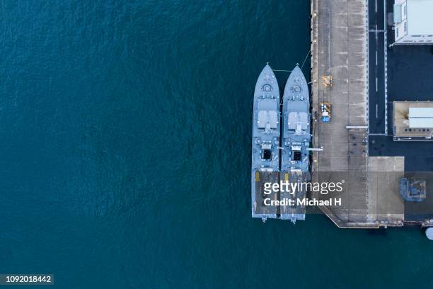 aerial shooting of battleships anchored. viewpoint from directly above. - legal defense stock pictures, royalty-free photos & images
