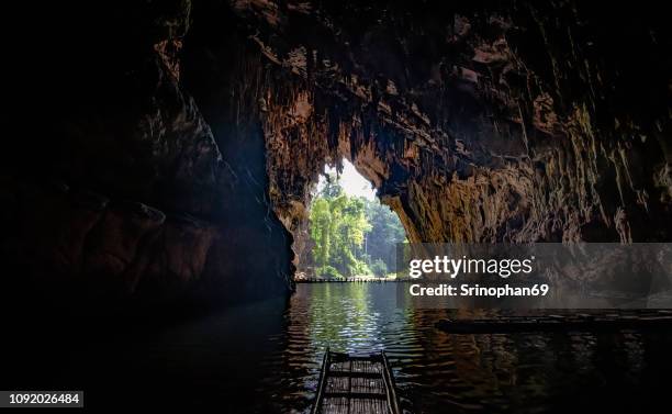 the beauty of the walls inside the cave is water flowing through is popular with tourists in mae hong son, unseen thailand, tham lod cave, one of the most amazing caves in thailand. - stalagmite stock pictures, royalty-free photos & images