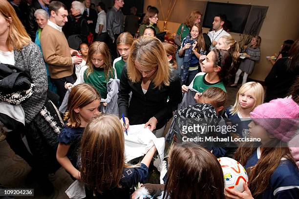 Professional soccer player Kristine Lilly signs autographs during the HBO Documentary Screening of "Kick Like A Girl" at HBO Building on November 20,...