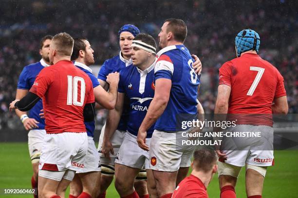 France's number eight Louis Picamoles is congratulted by teammtes after scorin a try during the Six Nations rugby union tournament match between...