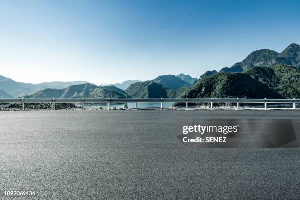 empty parking lot - empty road ストックフォトと画像