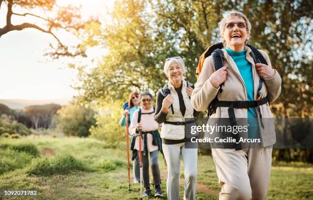 we're making tracks - senior women hiking stock pictures, royalty-free photos & images